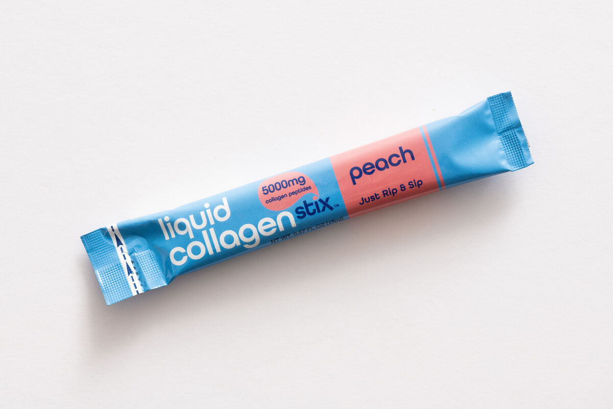 Liquid collagen stick pack with blue and pink packaging on a white background. Drinkable and great tasting liquid collagen Peach stick pack